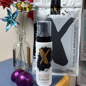 X tan sunless tanning mousse. Dark * streak free * quick dry * includes tan mitt